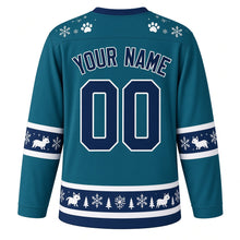 Load image into Gallery viewer, Ugly Christmas Arctic Fox Frolic Hockey Jersey in Aurora Teal, back view with a paw-print and snowflake yoke, sleeve and hem bands of little white foxes, pines and snowflakes, arched YOUR NAME lettering and 00 – custom name and number