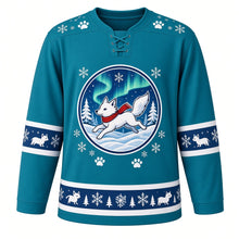 Load image into Gallery viewer, Ugly Christmas Arctic Fox Frolic Hockey Jersey in Aurora Teal, front view – aurora teal body with a round badge of a white arctic fox in a red scarf leaping through snow under green aurora lights with pines, paw-print and snowflake yoke and little-fox sleeve and hem bands – custom name and number