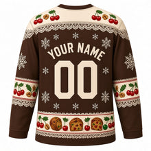 Load image into Gallery viewer, Ugly Christmas Fruitcake Fiasco Hockey Jersey in Chocolate Brown, back view with a doily and cherry yoke, cherry and nut sleeve bands, fruitcake-slice hem band, arched YOUR NAME lettering and 00 – custom name and number