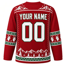 Load image into Gallery viewer, Ugly Christmas Mountain Goat Summit Hockey Jersey in Summit Red, back view with a snowy peak yoke, green and white goat-head sleeve bands, a snowy pine hem with a green zigzag band, YOUR NAME and 00 – your name and number