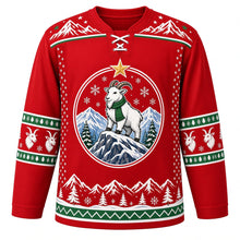 Load image into Gallery viewer, Ugly Christmas Mountain Goat Summit Hockey Jersey in Summit Red, front view – mountain goat in a green knit scarf on a snowy rocky peak with pines under a gold star, snowy mountain yoke and green and white goat sleeve bands – custom name and number