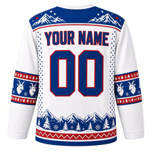 Load image into Gallery viewer, Ugly Christmas Mountain Goat Summit Hockey Jersey in Snowcap White, back view with a royal blue snowy-peak yoke, blue goat-head sleeve bands, a blue mountain-range hem, blue YOUR NAME and 00 – your name and number