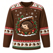 Load image into Gallery viewer, Ugly Christmas Hedgehog Holly Hideaway Hockey Jersey in Acorn Brown, front view – acorn brown body with a holly-patterned yoke with a brown hedgehog in a twig nest under a snowy hollow log with holly, red berries, acorns and red toadstools, plus hedgehog and acorn bands – custom name and number