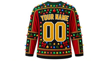 Load image into Gallery viewer, Ugly Christmas Tangled Lights Hockey Jersey in Black, back view – black body with forest-green yoke and cranberry side panels – a bulb-strung yoke, tinsel side panels and sleeve bands, a bulb hem stripe band, arched YOUR NAME lettering and a big 00 number – custom name and number