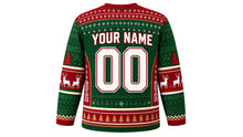 Load image into Gallery viewer, Ugly Christmas Reindeer Riot Hockey Jersey in Evergreen Green, back view – evergreen green body with red yoke, side panels and collar – a fair-isle yoke, patterned side panels and sleeve bands, a pine-tree hem stripe band, arched YOUR NAME lettering and a big 00 number – custom name and number
