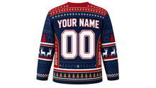 Load image into Gallery viewer, Ugly Christmas Reindeer Riot Hockey Jersey in Navy, back view – navy body with red yoke and side panels – a fair-isle yoke, patterned side panels and sleeve bands, a pine-tree hem stripe band, arched YOUR NAME lettering and a big 00 number – custom name and number