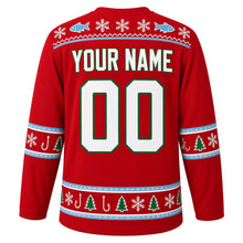 Load image into Gallery viewer, Ugly Christmas Ice Fishing Cabin Hockey Jersey in Cabin Red, back view with a fish-and-snowflake yoke, sleeve and hem bands of fish, hooks, pine trees and snowflakes, arched YOUR NAME lettering and 00 – custom name and number