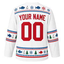 Load image into Gallery viewer, Ugly Christmas Ice Fishing Cabin Hockey Jersey in Arctic White, back view with a fish-and-snowflake yoke, sleeve and hem bands of fish, hooks, pine trees and snowflakes, arched YOUR NAME lettering and 00 – custom name and number