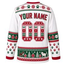Load image into Gallery viewer, Ugly Christmas Kitty Ornament Chaos Hockey Jersey in Snow White, back view with a paw-print, yarn-ball and snowflake yoke, cat-face and bauble sleeve bands, paw-print sleeves, a cats-trees-and-ornaments hem band, arched YOUR NAME lettering and 00 – custom name and number