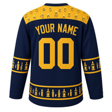Load image into Gallery viewer, Ugly Christmas Candlelit Lanterns Hockey Jersey in Midnight Blue, back view with lantern gold yoke of little candles, lantern and candle sleeve bands and a hem band of candles and lanterns, arched YOUR NAME and 00 – your name and number