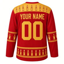 Load image into Gallery viewer, Ugly Christmas Candlelit Lanterns Hockey Jersey in Holly Red, back view with lantern gold yoke of lit candles, lantern sleeve bands with checker trim and a hem row of glowing candles, arched YOUR NAME and 00 – your name and number