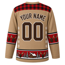 Load image into Gallery viewer, Ugly Christmas Moose Lodge Hockey Jersey in Woodland Tan, back view with a plaid yoke, antler and pinecone sleeve bands, pinecone and cabin hem band, arched YOUR NAME lettering and 00 – custom name and number