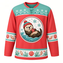 Load image into Gallery viewer, Ugly Christmas Sea Otter Snowfall Hockey Jersey in Coral Red, front view – coral red body, round chest crest of a sea otter on its back in a red pom-pom hat holding a starfish with snowflakes and waves, seafoam mint wave and snowflake yoke, seashell sleeve bands and a kelp, shell and bubble hem – custom name and number