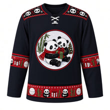 Load image into Gallery viewer, Ugly Christmas Panda Snow Romp Hockey Jersey in Midnight Black, front view – round snow-globe style crest of two pandas sharing a hug and a green gift box with a red scarf, panda-face yoke, red bamboo and gift sleeve bands and a red panda and snowball hem band – custom name and number