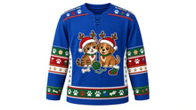 Load image into Gallery viewer, Ugly Christmas Pawsitively Festive Hockey Jersey in Cobalt Blue, front view – cobalt blue body with a round cartoon cat-and-dog crest in Santa hats and antlers with yarn, bone and stocking, paw-print yoke, paw and stocking sleeve bands and a paw-print hem band – custom name and number