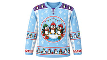 Load image into Gallery viewer, Ugly Christmas Penguin Party Hockey Jersey in Glacier Blue, front view – glacier ice blue body with a round three-penguin party crest on an ice floe with gifts and lights, penguin yoke, penguin sleeve bands and a penguin-parade hem band – custom name and number