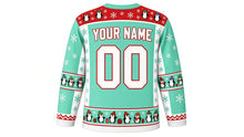 Load image into Gallery viewer, Ugly Christmas Penguin Party Hockey Jersey in Mint Green, back view with a penguin and snowflake yoke, penguin sleeve bands, penguin-parade hem band, YOUR NAME lettering and 00 – custom name and number