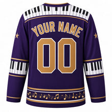 Load image into Gallery viewer, Ugly Christmas Piano Lounge Noel Hockey Jersey in Royal Purple, back view with a piano-key yoke on royal purple, piano-key elbow bands, a music-note hem band and gold YOUR NAME and 00 – your name and number