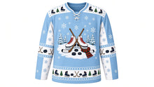 Load image into Gallery viewer, Ugly Christmas Frozen Pond Skate Hockey Jersey in Ice Blue, front view – ice blue body with a round frozen-pond crest with white skates, crossed hockey sticks, pucks, pines and scarf, skate-and-pine yoke, stick and puck sleeve bands and a skate hem band – custom name and number