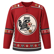 Load image into Gallery viewer, Ugly Christmas Raccoon Cookie Heist Hockey Jersey in Berry Red, front view – round crest of a masked raccoon sneaking off with a frosted star cookie next to a glass of milk and a cookie plate, cookie and milk yoke, black-striped paw print elbow bands, black checkerboard side panels and a raccoon and star cookie hem band – custom name and number