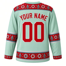 Load image into Gallery viewer, Ugly Christmas Tin Toy Robots Hockey Jersey in Mint Green, back view with a red robot, gear and star yoke, matching robot and gear sleeve and hem bands, arched YOUR NAME lettering and 00 – custom name and number