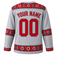 Load image into Gallery viewer, Ugly Christmas Tin Toy Robots Hockey Jersey in Silver Gray, back view with a red robot, gear and star yoke, matching robot and gear sleeve and hem bands, arched YOUR NAME lettering and 00 – custom name and number