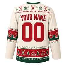 Load image into Gallery viewer, Ugly Christmas Ski Lodge Apres Hockey Jersey in Fireside Cream, back view with a yoke of skis, poles and snowflakes, cocoa-mug and mitten sleeve bands, a skis-pines-and-cabins hem band, arched YOUR NAME lettering and 00 – custom name and number