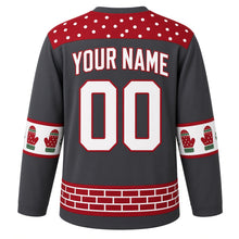 Load image into Gallery viewer, Ugly Christmas Snowball Fight Frenzy Hockey Jersey in Charcoal Gray, back view with a red snowball polka-dot yoke, knit mitten sleeve bands, a red brick hem band, YOUR NAME and 00 – your name and number
