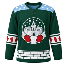 Load image into Gallery viewer, Ugly Christmas Snowball Fight Frenzy Hockey Jersey in Pine Green, front view – round crest of a snow castle with a turret, flying snowballs and red mittens, light blue snowball yoke, red mitten sleeve bands and a white snow-brick hem band – custom name and number