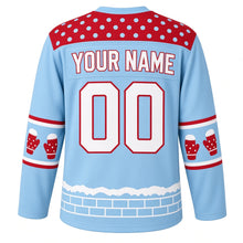 Load image into Gallery viewer, Ugly Christmas Snowball Fight Frenzy Hockey Jersey in Ice Blue, back view with a red snowball polka-dot yoke, red mitten sleeve bands, a snowdrift and ice-brick hem, YOUR NAME and 00 – your name and number