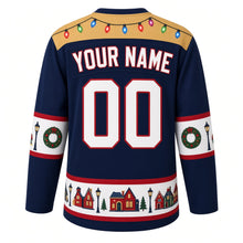 Load image into Gallery viewer, Ugly Christmas Christmas Village Lights Hockey Jersey in Evening Blue, back view with a string-light yoke, street-lamp and wreath sleeve bands, snowy rooftop hem band, arched YOUR NAME lettering and 00 – custom name and number