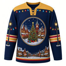 Load image into Gallery viewer, Ugly Christmas Christmas Village Lights Hockey Jersey in Evening Blue, front view – evening blue body with gold yoke with a round snowy town square crest with a decorated tree, clock tower and glowing shops, string-light yoke, street-lamp sleeve art and a snowy rooftop hem band – custom name and number