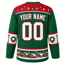 Load image into Gallery viewer, Ugly Christmas Christmas Village Lights Hockey Jersey in Garland Green, back view with a string-light yoke, street-lamp and wreath sleeve bands, snowy rooftop hem band, arched YOUR NAME lettering and 00 – custom name and number