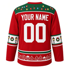 Load image into Gallery viewer, Ugly Christmas Christmas Village Lights Hockey Jersey in Lantern Red, back view with a string-light yoke, street-lamp and wreath sleeve bands, snowy rooftop hem band, arched YOUR NAME lettering and 00 – custom name and number