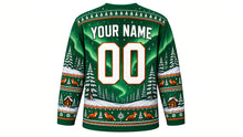 Load image into Gallery viewer, Ugly Christmas Winter Wonderland Hockey Jersey in Spruce Green, back view with arched YOUR NAME lettering, a big 00, a northern-lights sky, a pine forest and fox and snowflake hem band – custom name and number