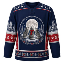 Load image into Gallery viewer, Ugly Christmas Moonlit Wolf Pack Hockey Jersey in Midnight Navy, front view – midnight navy body with a star-and-crescent-moon yoke with a round crest of three wolves, one in a red scarf, howling at a full moon above snowy pines, plus pine tree and paw print sleeves and a holly-and-snowflake hem band – custom name and number