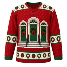 Load image into Gallery viewer, Ugly Christmas Evergreen Wreath Doorways Hockey Jersey in Door Red, front view – chest scene of three arched front doors, each hung with an evergreen wreath and red bow, above snowy steps with black railings on a door red body, cream wreath yoke, cream wreath elbow bands and a cream wreath hem band – custom name and number