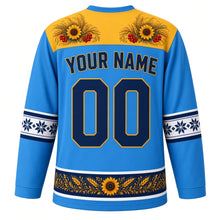 Load image into Gallery viewer, Ukraine Original Hockey Jersey in Carpathian Blue, back view with your name and number – Petrykivka-painted yoke and vyshyvanka embroidery sleeve bands