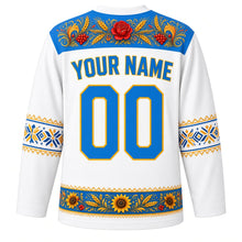 Load image into Gallery viewer, Ukraine Original Hockey Jersey in Linen White, back view with your name and number – Petrykivka-painted yoke and vyshyvanka embroidery sleeve bands