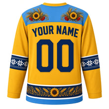 Load image into Gallery viewer, Ukraine Original Hockey Jersey in Wheat Field Yellow, back view with your name and number – Petrykivka-painted yoke and vyshyvanka embroidery sleeve bands