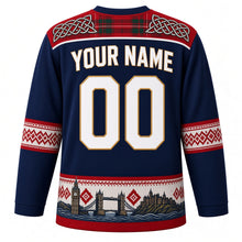 Load image into Gallery viewer, United Kingdom Original Hockey Jersey in Channel Navy, back view with your name and number – tartan and Celtic knot yoke with Fair Isle sleeve bands