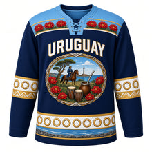 Load image into Gallery viewer, Uruguay Original Hockey Jersey in Atlantic Navy, front view – ornate oval cameo crest with gaucho, ombú tree, candombe drums and ceibo flowers, detailed artwork, custom name and number