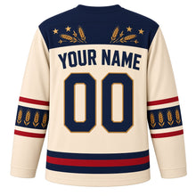 Load image into Gallery viewer, USA Patriotic Amber Waves Prairie Hockey Jersey in Wheat Cream, back view with your name and number – golden wheat stalks and small white stars on navy yoke with matching sleeve and hem bands