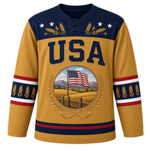 Load image into Gallery viewer, USA Patriotic Amber Waves Prairie Hockey Jersey in Harvest Gold, front view – golden wheat fields and purple mountains with a waving American flag, custom name and number