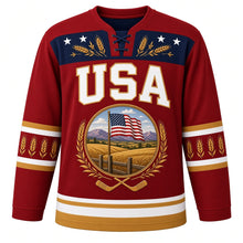 Load image into Gallery viewer, USA Patriotic Amber Waves Prairie Hockey Jersey in Barn Red, front view – golden wheat fields and purple mountains with a waving American flag, custom name and number