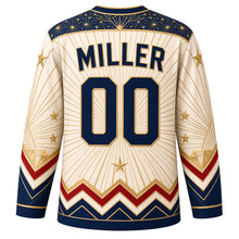 Load image into Gallery viewer, USA Patriotic Art Deco Stars and Rays Hockey Jersey in Champagne Ivory, back view with your name and number – a geometric deco fan pattern with tiny gold stars and stepped gold lines yoke with matching sleeve and hem bands