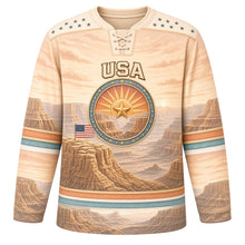 Load image into Gallery viewer, USA Patriotic Canyon Sunset Flag Hockey Jersey in Mesa Sandstone, front view – pale sandstone mesas under a soft peach sky with turquoise stripes, custom name and number