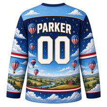Load image into Gallery viewer, USA Patriotic Liberty Balloon Skies Hockey Jersey in Starlit Navy, back view with your name and number – a band of puffy white clouds and tiny gold stars yoke with matching sleeve and hem bands