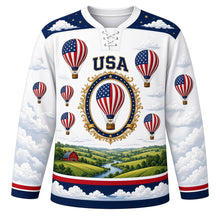 Load image into Gallery viewer, USA Patriotic Liberty Balloon Skies Hockey Jersey in Cumulus White, front view – stars-and-stripes hot-air balloons over rolling countryside, custom name and number