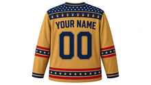 Load image into Gallery viewer, USA Patriotic Liberty Bell Crest Hockey Jersey in Brass Gold, back view with your name and number – starry bell-and-ribbon yoke with ribbon sleeve bands and gold-edged hem band